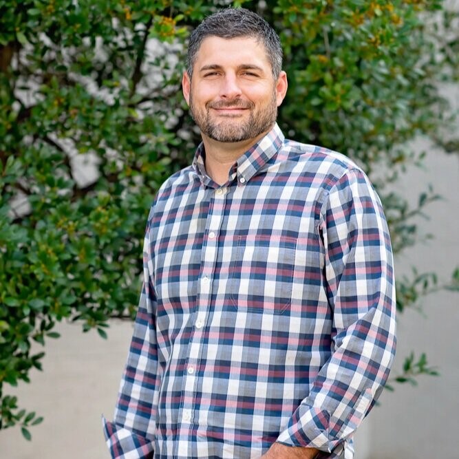 a profile picture of Jeff Brown, a speaker at the conference.